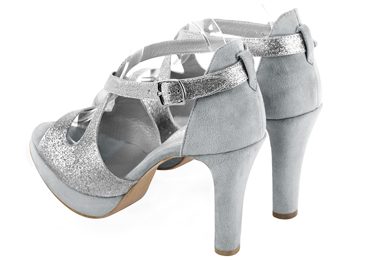 Light silver and pearl grey women's closed back sandals, with crossed straps. Round toe. Very high slim heel with a platform at the front. Rear view - Florence KOOIJMAN